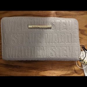 Brand New Grey Michel Kors Wrist Wallet .